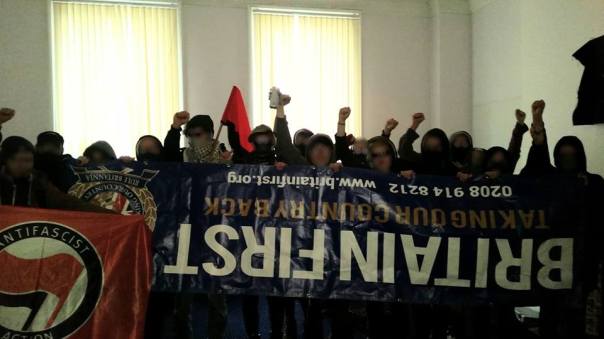 Antifascists with the seized BF banner.
